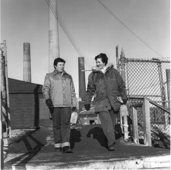 Olive Richer and Marie Emery walking in front of the Sudbury INCO plant.