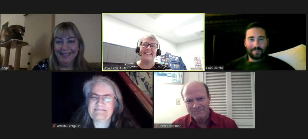 There are five people in individual boxes, in the format of an online meeting - on a black background.