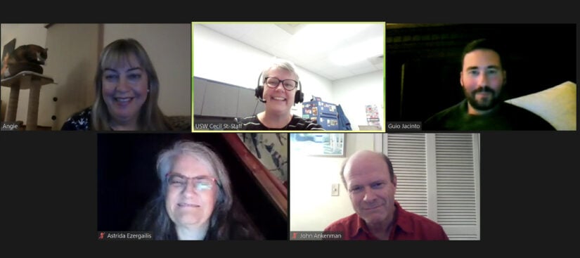 There are five people in individual boxes, in the format of an online meeting - on a black background.