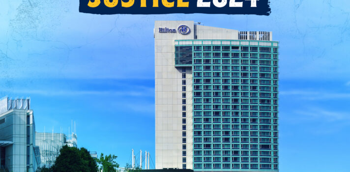 A photo of a Hilton hotel by a lake with the logo of the Justice conference 2024 at the very top.