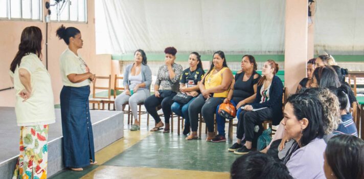 A person facilitating a workshop to a group of people.