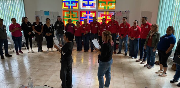Two people facilitating a workshop in a room.